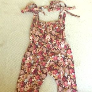 A rumper with flowers design on it